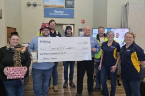 Didion employees present check to Cambria Kiwanis representatives