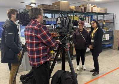 Mother of three being interviewed by local news media about impact of food pantry on her family