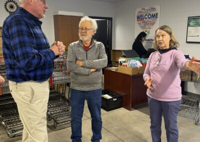 Didion representative hears from Extended Hands Pantry representatives about the need for more donations like Didion's